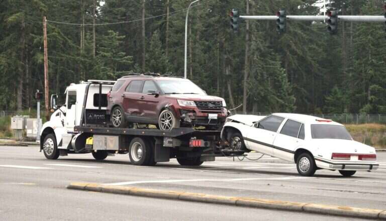 Amani Towing flatbed tow truck on a Birmingham road